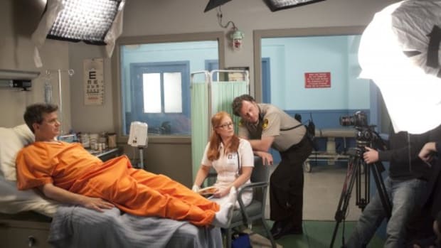 Co-creator John Lehr (in orange jumpsuit) on the set of "Jailbait."