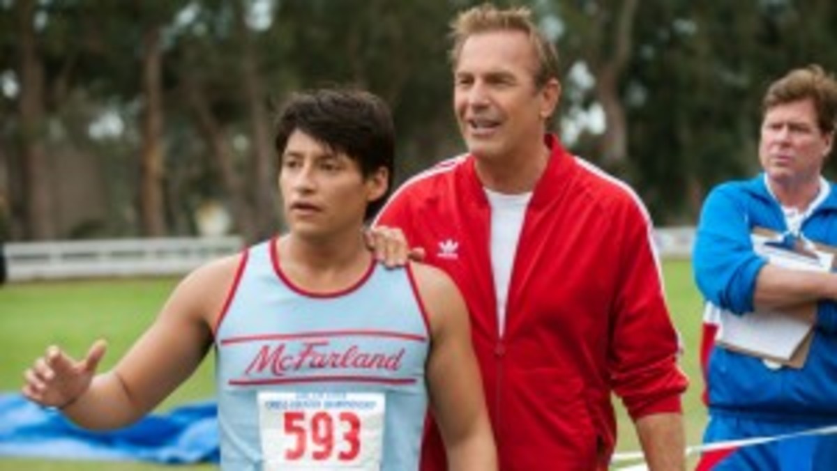 Coach Jim White (Kevin Costner) and Thomas Valles (Carlos Pratts) share a moment of triumph in a triumphant film.