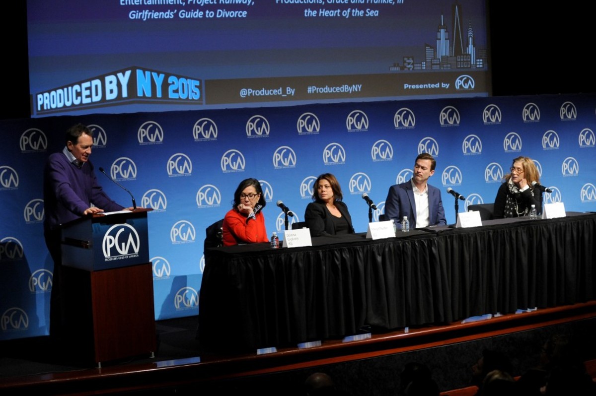 NEW YORK, NY - OCTOBER 24: Gary Lucchesi speaks with producers Meryl Poster, Donna Gigliotti, Michael Travers and Paula Weinstein during the PGA Produced By: New York Conference at Time Warner Center on October 24, 2015 in New York City. (Photo by Brad Barket/Getty Images for Producers Guild of America)