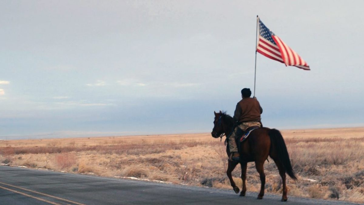 Duane Ehmer rides out to confront the press after the killing of Lavoy Finicum. Film still from NO MAN'S LAND.