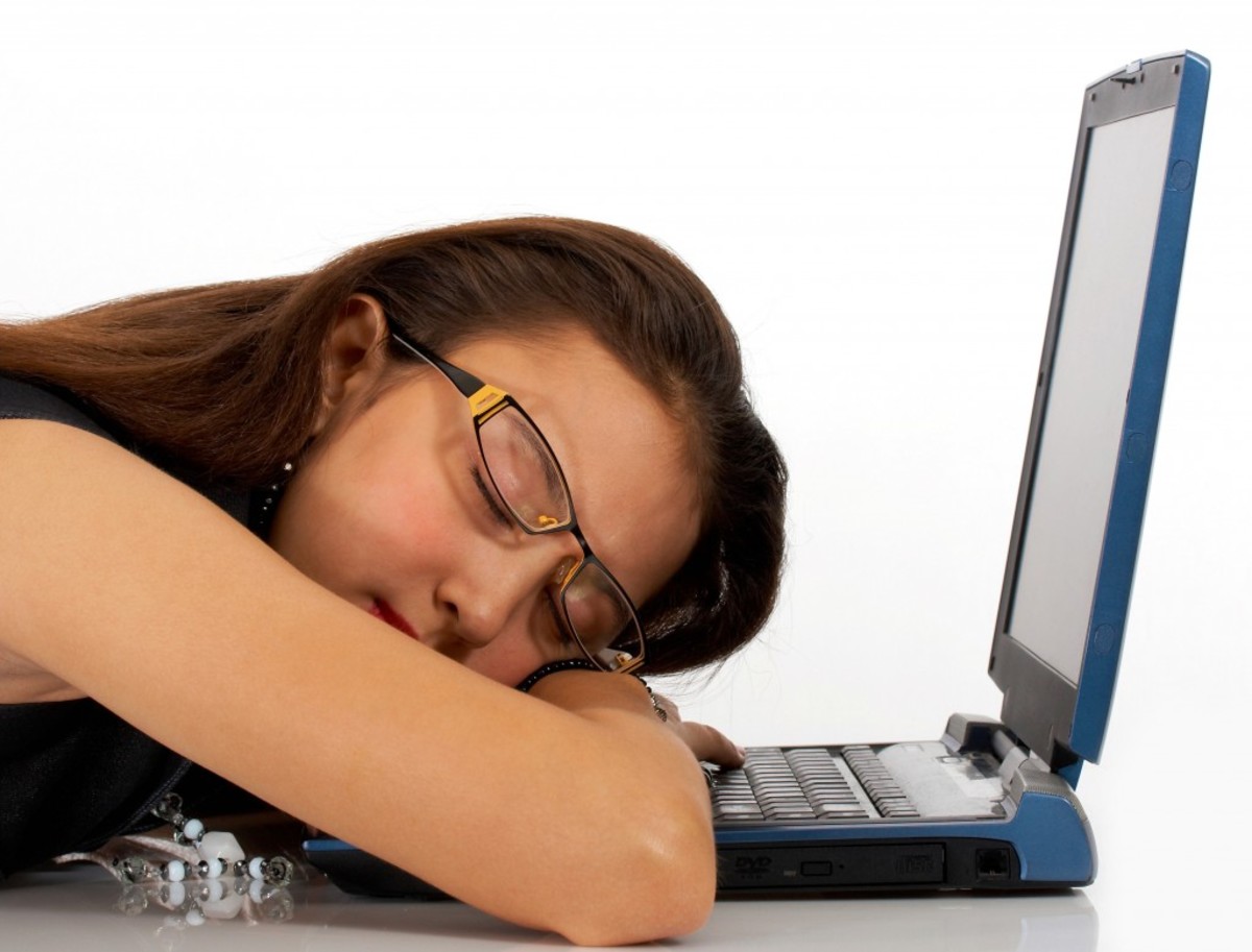 Girl Asleep On Her Notebook Computer