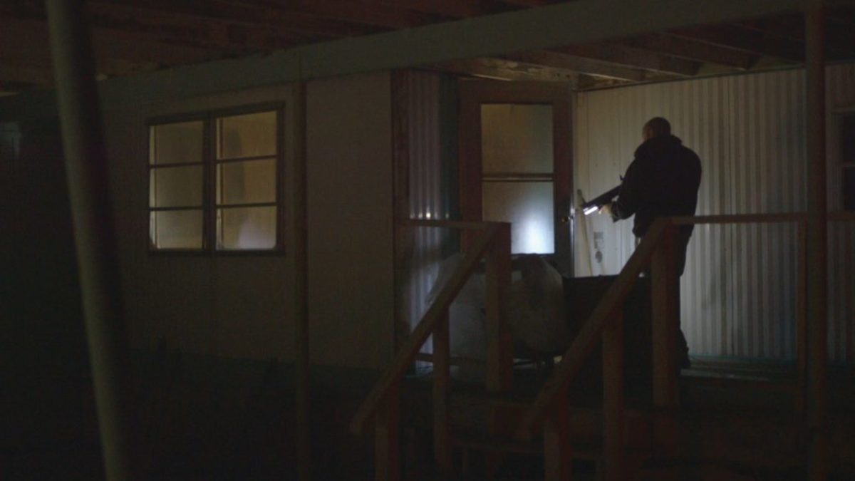Armed occupiers explore and secure buildings at the Malheur National Wildlife Refuge headquarters. Film still from NO MAN'S LAND.