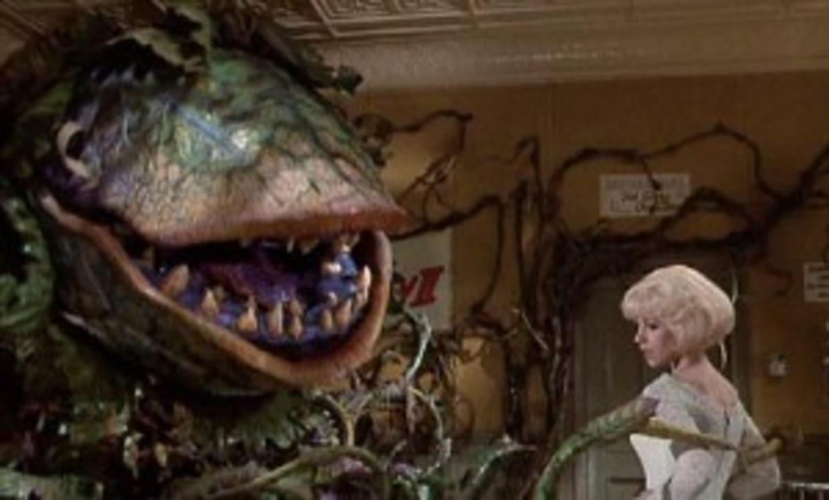 Audrey II needs a little something to drink in Little Shop of Horrors.