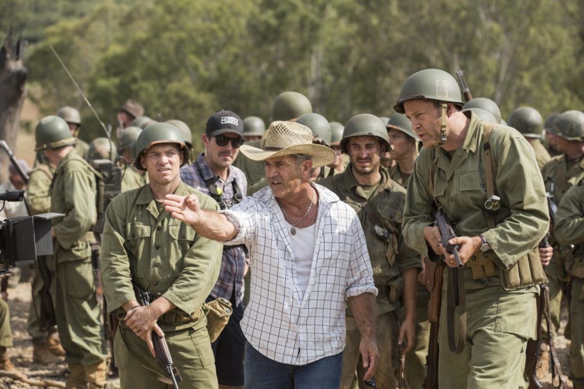 From left to right: Sam Worthington, Director Mel Gibson, and Vince Vaughn on the set of HACKSAW RIDGE. Photo Credit: Mark Rogers