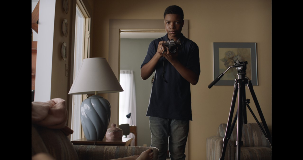 Leroy (Elijah M. Cooper) capturing a truthful moment through the lens
