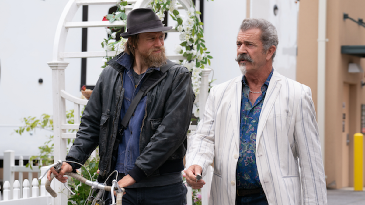 (L-R) Charlie Hunnam as Charlie Waldo and Mel Gibson as Alastair Pinch in the action/comedy, undefinedLAST LOOKS, an RLJE Films release. Photo courtesy of RLJE Films.