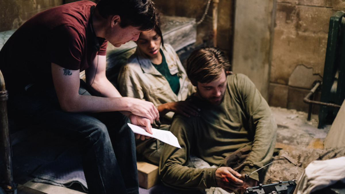 [L-R] Director, Jonathan W. Stokes, Georgina Campbell as Khadija Young, and Luke Benward as Luke White behind the scenes of the thriller WILDCAT, a Saban Films release. Photo courtesy of Saban Films.