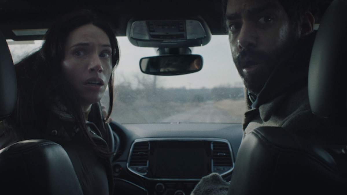 [L-R] Katie Parker as Rose and Rahul Kohli as Teddy in the fantasy horror dramedy NEXT EXIT. Photo Courtesy of No Traffic For Ghosts LLC.